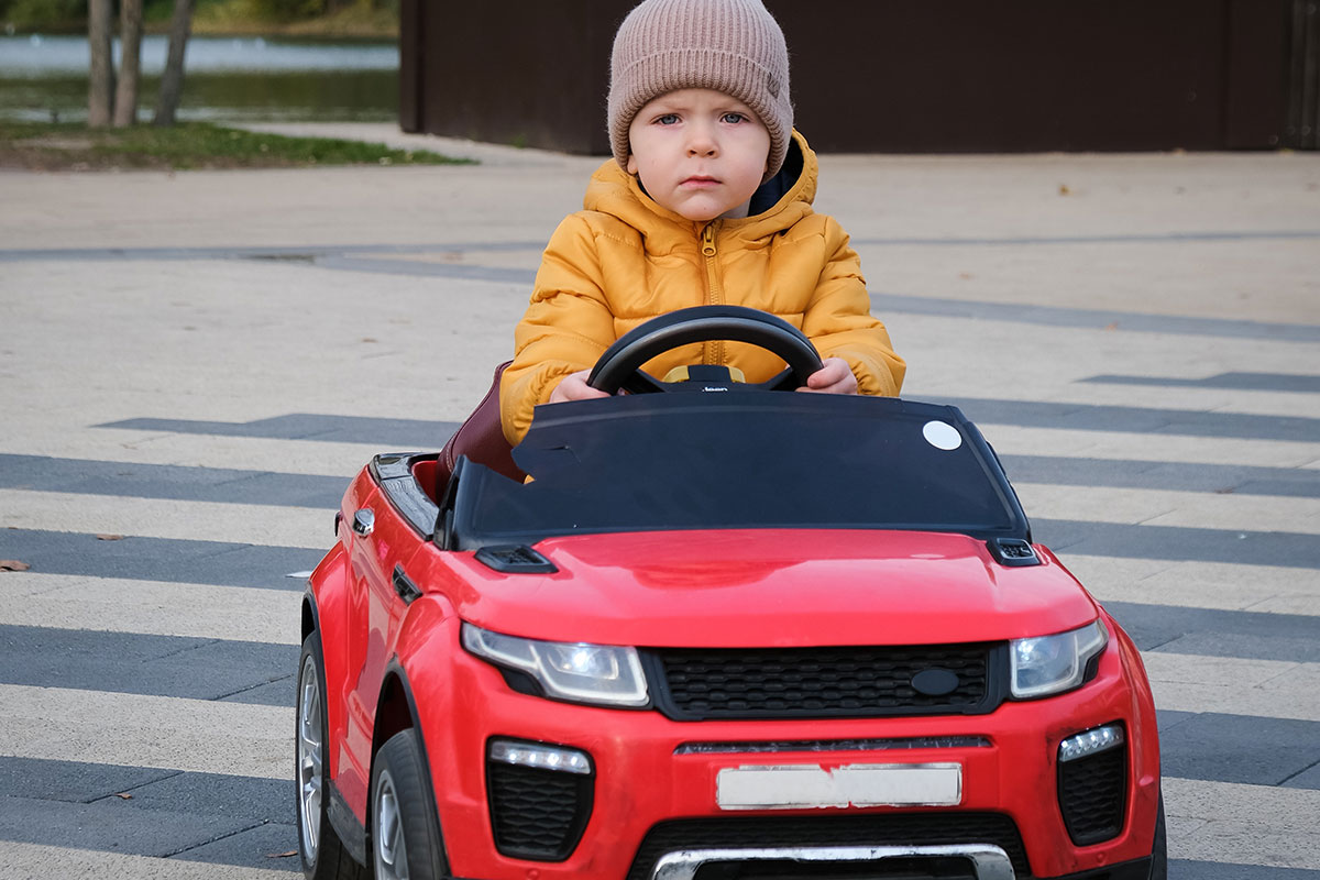 Kid in toy car